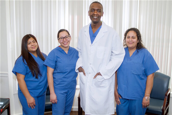 Group photo of Dr Musha and staff members